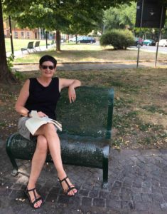 Gayle sitting in Piazza di Porta Sarragozza