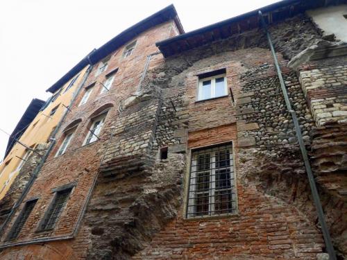 The amphitheatre's stepped seating was eventually replaced by shops and houses, but even today evidence of Roman construction can still be seen