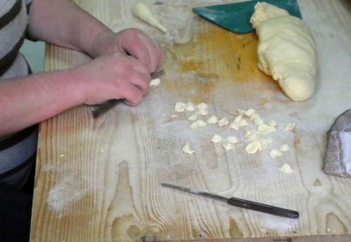 They're skillful and incredibly fast - in a single second they cut off a tiny piece of dough, use their thumb to create the orecchietta shape, set it aside and are ready for the next one