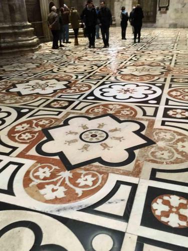 The Cathedral's floor of pink, black and red  marble dates from the 15th century