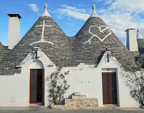 The symbols painted on the roofs themselves are significant too - they're primitive, magic or Christian; this one on the right represents the Virgin Mary's pierced heart