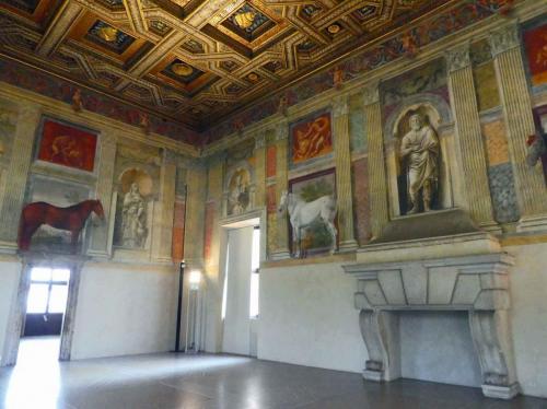 The doorway provides a perspective on the size of the marble fireplace