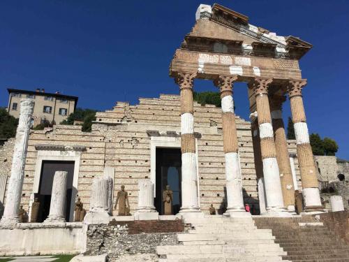 The woman in red at the base of the column gives an idea of their size