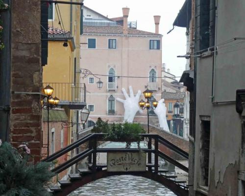 Looking towards the Grand Canal and the famous 'Support' sculpture highlighting the issue of climate change