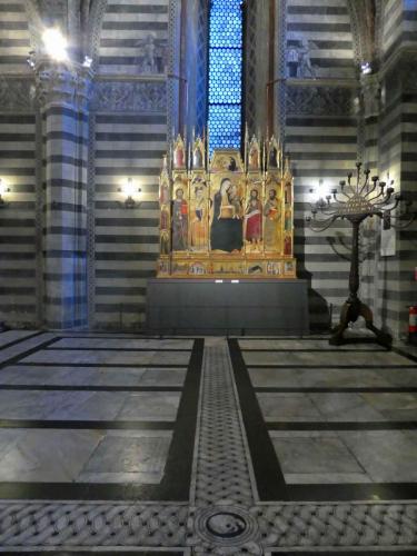 And in the Bapistery, the magnificent altar piece created by Andrea Vanni in the 14th century