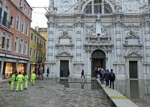 But the Venetians are well used to the problem and within minutes the city's staff have the temporary boardwalks in place and life goes on as usual