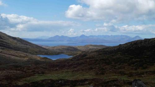 Light snow fell as we crossed the top and then, as we started down the other side, views like this opened up before us