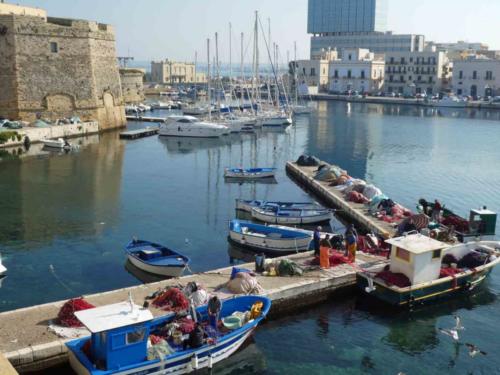 But the life of a fisherman isn't an easy one; the job of sorting and mending the nets is never-ending