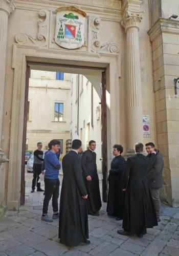 Seminarians waiting to welcome parishioners attending mass in the city's cathedral