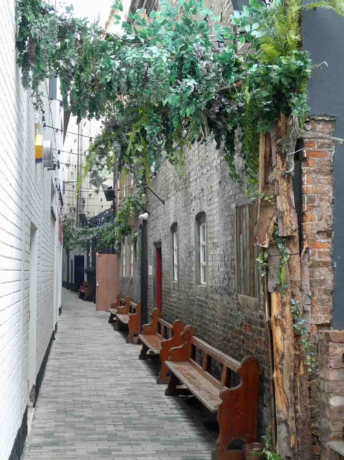 The Entries, the narrow pedestrian streets in central Belfast, were once crowded with shops and houses; this is Joy's Entry, named for Francis Joy, who founded the Belfast News Letter in 1737 (it was the British Isles' first daily newspaper and is still going strong)