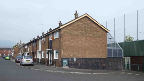 On some houses built alongside the walls you can still see protective measures that were employed; the structure attached to the back of this house is known as a 'grenade cage' (the idea was that if a device was thrown over the wall, it would bounce off the cage and not explode onto the house itself)