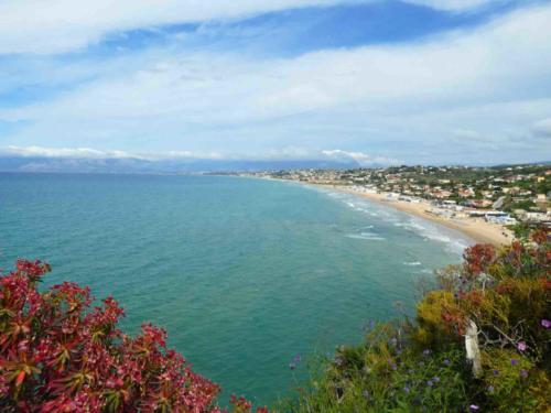 After you turn right onto the region's north coast, the landscape changes again and stretches of sandy beach begin to appear