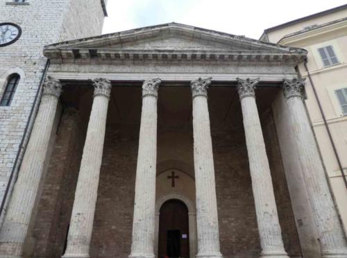 Here's a structure that has nothing to do with St Francis; it's the Roman Temple of Minerva built in the 1st century (though the building has housed a church since the 1540s)