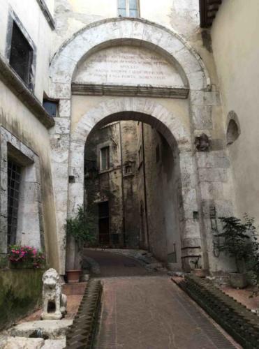And looking back the other way to Porta Fuga, one of the old city gates (13th century); it stands on the site of an even older Roman gate (you can see some of the original Roman paving at the side of the path)