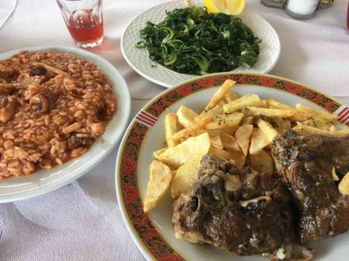 Braised goat - from the family's herd - and cuttlefish in tomato sauce; really, everything that hit the table in this little restaurant was absolutely delicious!