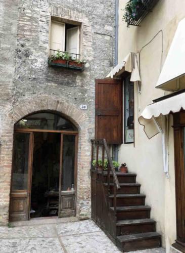 Through the gate the path opens up to this little piazzetta (there's an interesting stairway to nowhere on the right); our front windows look down onto this area