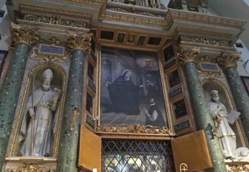 Inside the public church attached to the monastery, there's a sign that says 'press the bell for more information' - so of course we did; a small grille popped open and a nun began telling us the story of Saint Clare