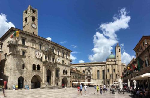 The main square, Piazza del Popolo, with its beautiful Renaissance buildings and spectacular travertine marble paving