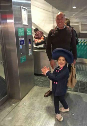 Aila is pretty excited to be going to Disneyland (that's a travel pillow she's wearing on her head)