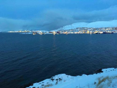 In the distance (far left) you can see the LNG plant on Melkøya island; the project has led to an economic boom in the region (in contrast to other areas of the north), but there have been concerns about potential pollution risks too