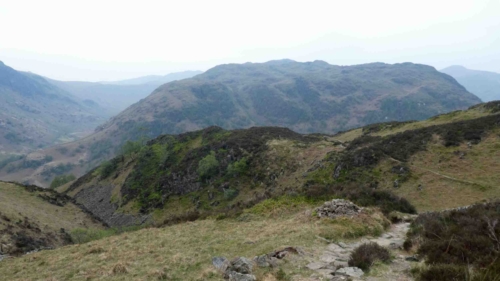 A hill (or fell) is classified as a 'Wainwright' if it's mentioned in Wainwright's books (he mentions 214 of them!) - 'bagging the Wainwrights' is a thing for serious Lake District walkers