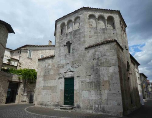 The 12th century Romanesque Baptistery stands beside the cathedral