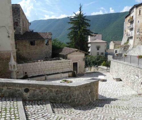 This small piazza, just outside the medieval centre, was a hub of activity in the Middle Ages; villagers would bring their washing to the water troughs just on the left, and each evening shepherds would walk their sheep up the path on the right, water their animals here, then lead them safely inside for the night locking the city gate behind them