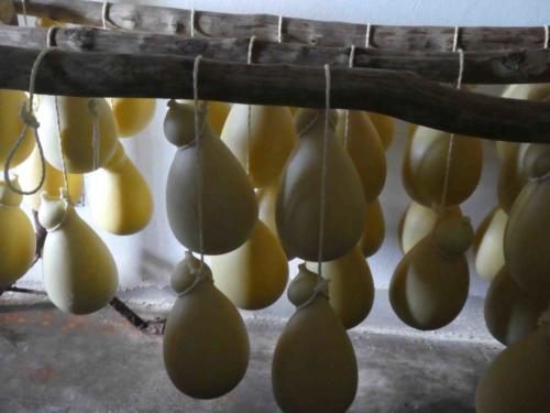 Caciocavello starts off almost white and yellows as it ages