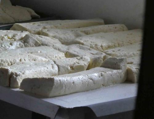 The other end of this two-roomed hut is where the cheese is produced