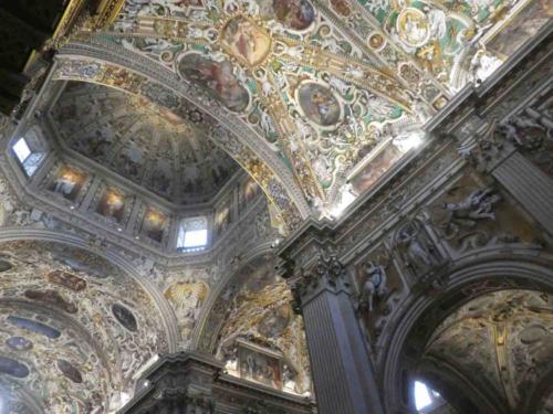 In stark contrast to its very plain exterior, the interior of the church is adorned with spectacular frescoes, tapestries, parquetry and paintings