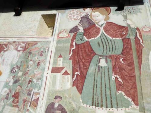 Murals on the exterior walls of the church date from 1450