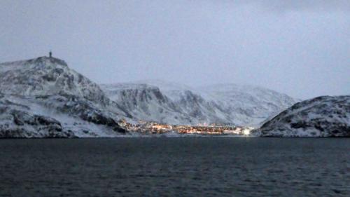 Aglow in the midday light, a small town south of Hammerfest
