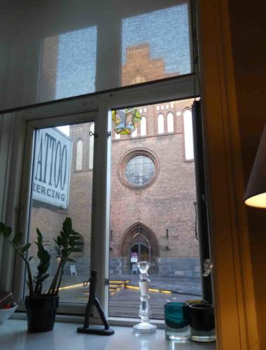 Directly above the tattoo parlour and across the road from the church/theatre (we weren't sure what it was and in the end decided it was both)