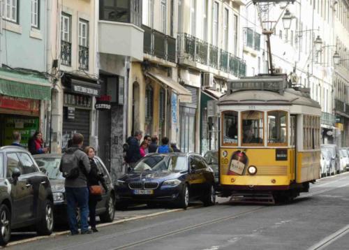 Usually trams and cars happily share Lisbon's sometimes narrow streets