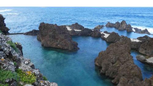 On the other side of the island, in the north-west, you find these black lava pools 