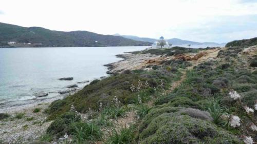To reach this little church we had to walk along the pebble beach at low tide