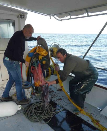 It was all hands on deck (well, not my hands obviously ... I was busy leaning over the side of the boat) to retrieve the prized catch