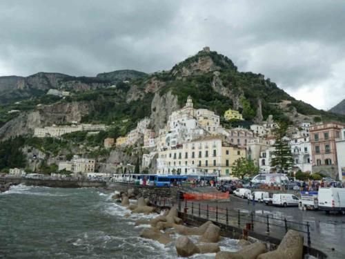 The pretty waterfront, and just a few of the buses unloading people into the town