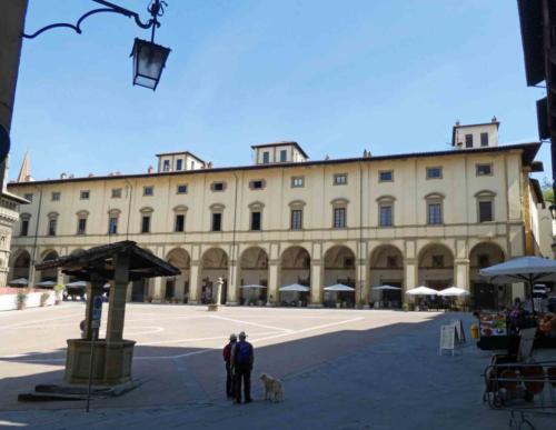 Piazza Grande; from its position at the top of the sloping square, Giorgio Vasari's   Palazzo delle Logge (1595) dominates the piazza
