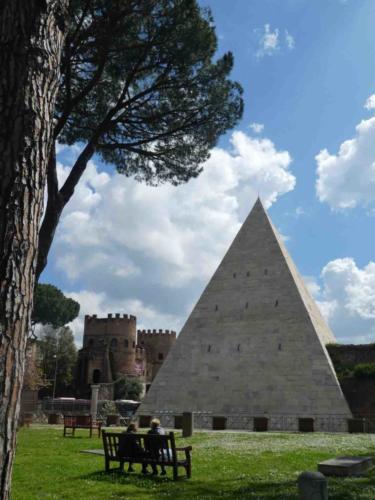 The burial pyramid of Caius Cestius (18-12 BC) is a landmark in a quiet corner of the cemetery; in 3 AD the pyramid was  incorporated into Rome's Aurelian Walls and formed part of the city's defenses
