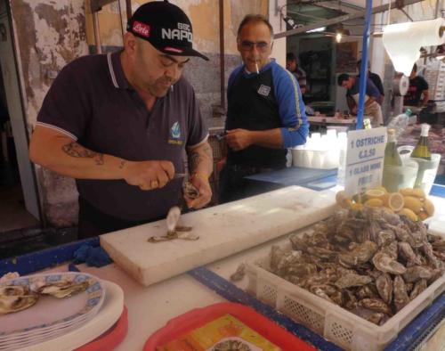 The oyster shucker's stand where you ask for a couple and for five euros he serves you up half a dozen oysters and two cups of sparkling, cold prosecco