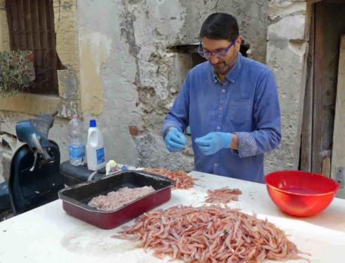 We found this man outside his house early one morning; he'd been to the market and was cleaning prawns that would soon be on plates in his nearby restaurant