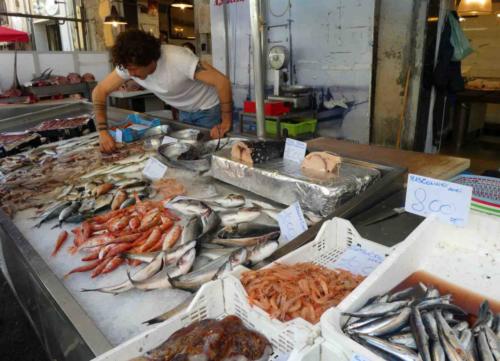 Sights and smells here are accompanied by the shouts of vendors exhorting shoppers to buy 