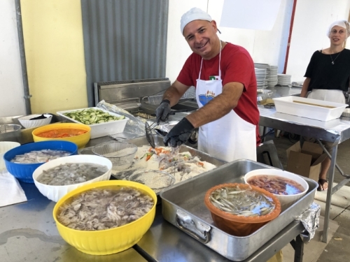 And it's amazing. Each night they produce hundreds of meals in a make-shift kitchen, and every dish that comes out is exceptional. How do they do that?