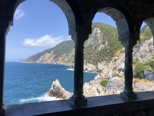 Behind the church, the coast curves north, towards the Cinque Terre.