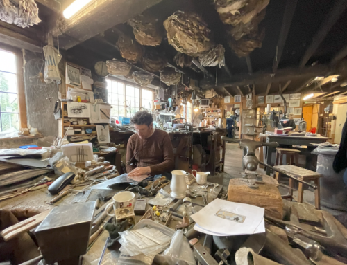 This is William Hart. Those spikes in the ceiling above William's head are where the customer receipts are stored - 111 years' worth.
