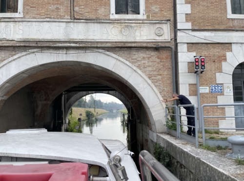 To accommodate that, vessels have to negotiate five locks, pass by nine swing-bridges, and travel under numerous other fixed bridges ...