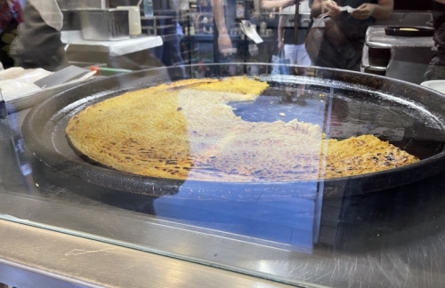 This is not a great photo, but you get the idea. The farinata mixture is poured onto huge trays and cooked for a few minutes at around 260°C in the wood-fired oven.