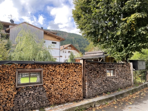 Though the autumn weather here is mild, there are clear signs of the winter to come; already firewood is stacked into every available nook and cranny - even in the fence.