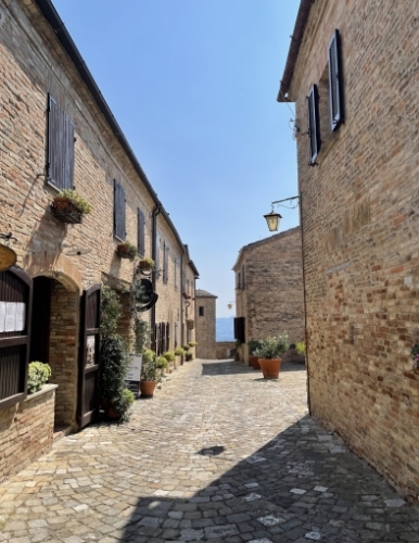 Montegridolfo is a tiny walled village on a hill, with just two streets that run up to an old castle.